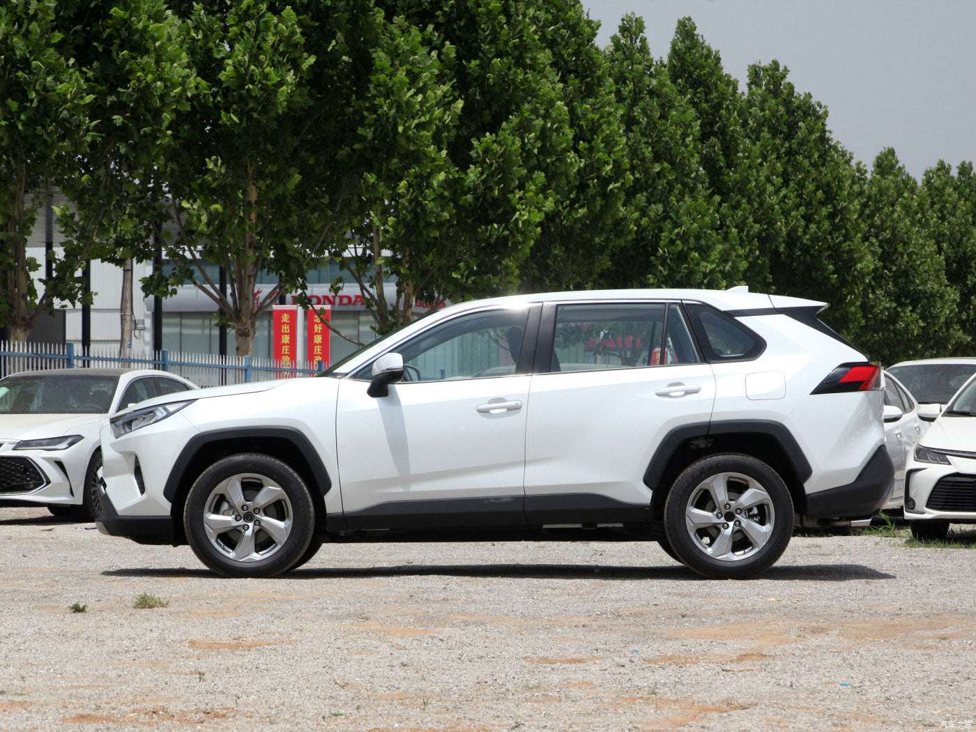 For the Toyota Rav 4 SUV in Japan for adults, featuring left-side power fabric seats and rear camera