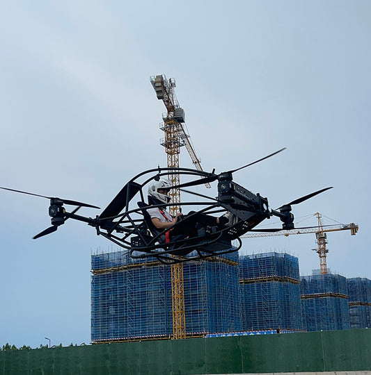 Professional quadcopter with a maximum payload of 100 kg and a manned electric vertical take-off and landing aircraft
