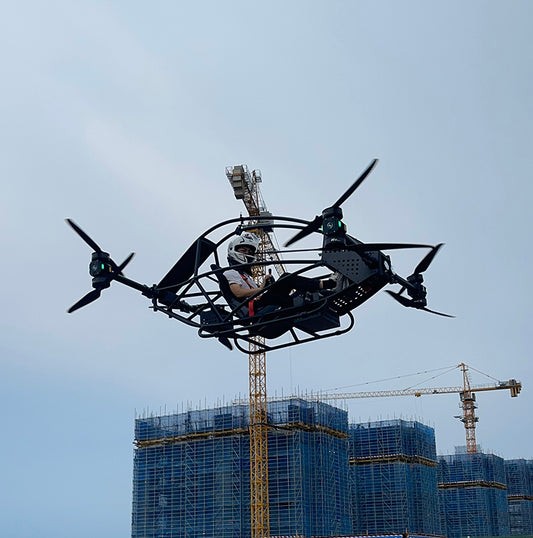 Professional quadcopter with a maximum payload of 100 kg and a manned electric vertical take-off and landing aircraft