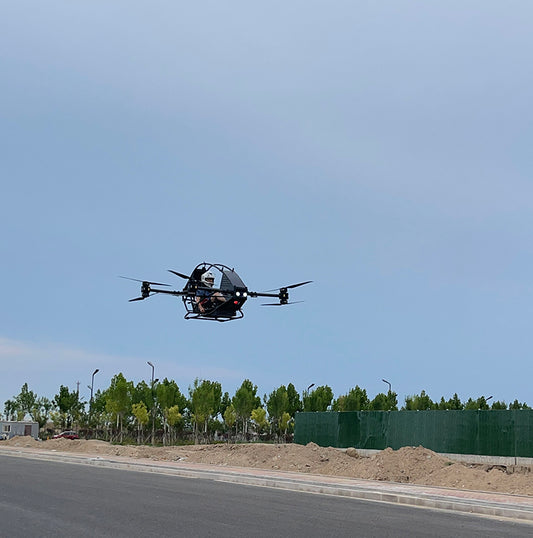 Professional quadcopter with a maximum payload of 100 kg and a manned electric vertical take-off and landing aircraft