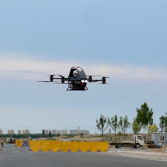 Professional quadcopter with a maximum payload of 100 kg and a manned electric vertical take-off and landing aircraft