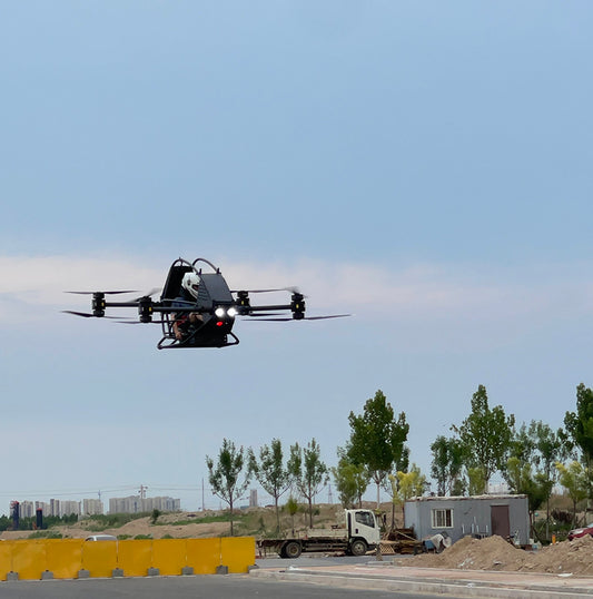 Professional quadcopter with a maximum payload of 100 kg and a manned electric vertical take-off and landing aircraft