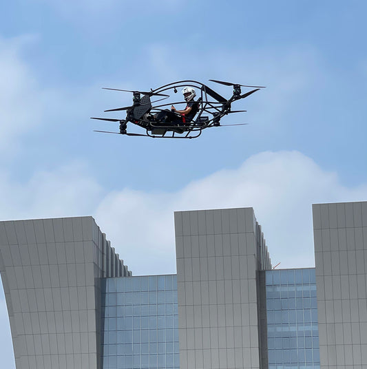 Professional quadcopter with a maximum payload of 100 kg and a manned electric vertical take-off and landing aircraft
